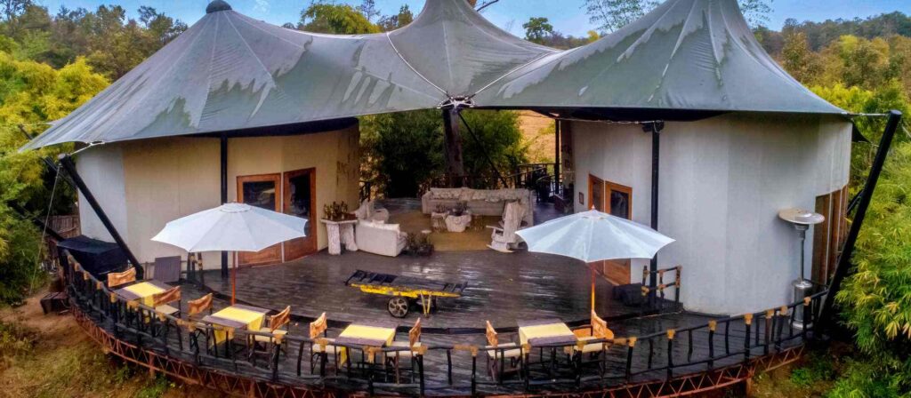 Kanha National Park, Kanha Tiger Safari, Kanha Safari Booking, Barasingha Kanha, Best time to visit Kanha, Eco-lodges in Kanha, Kanha National Park activities, Tribal experiences Kanha, Family adventure safaris India, Tiger walking in Kanha forest, Baiga tribe sharing forest stories, Jeep safari group in Kanha meadows, Luxury safari lodge in Kanha, Traveler packing for Kanha tiger safari
